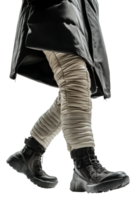 Person walking in padded pants and sturdy boots, cut out - stock . png
