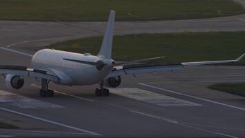 Jet airliner braking after landing. Aircraft arriving at sunset or sunrise. Spoilers up. Airplane slowdown on dawn video