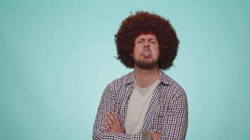 Funny man showing tongue making faces at camera, fooling around, joking, aping with silly face video
