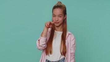 Pretty child girl pointing at her eyes and camera, show I am watching you gesture, spying on someone video