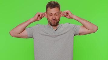 Funny man making playful silly facial expressions and grimacing, fooling around, showing tongue video