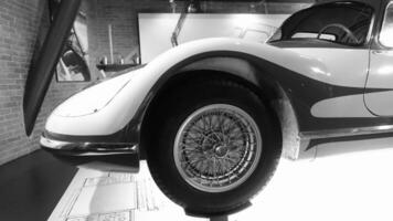 Turin, Italy - June 20, 2021. a detail of an antique automobile at Automobile Museum. photo