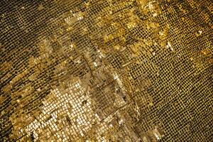 A lame texture background features a shimmering, metallic fabric with a smooth and reflective surface photo