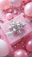 pink gift party box with silver ribbon bow on background with colorful balloons, confetti.party concept or birthday celebration photo