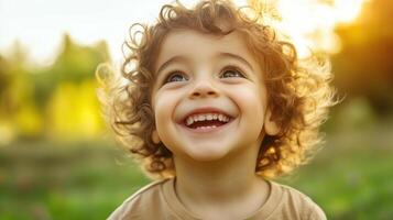 Happy smiling child with curly hair photo