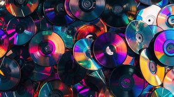 Colorful stack of CDs in a chaotic pile photo
