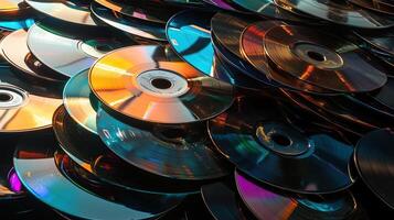 Colorful stack of CDs in a chaotic pile photo