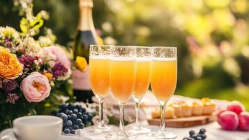 Springtime brunch mimosas table with flowers and decorations. photo
