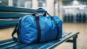 A blue gym bag placed on a bench in a locker room photo