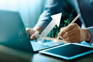 Businessman Analyzing Stock Market Trends on Laptop and Tablet with Upward Arrow and Trading Data, Representing Financial Growth and Investment Strategies in Modern Technology, Forex Trading photo
