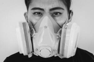 Portrait of sickness woman while wearing a gas mask for prevent and protection virus disease in covid-19 pandemic. photo