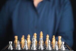 Chessboard game for ideas and competition. Businessman playing chess board game for development analysis new strategic planning. Strategy and business success concept photo