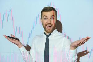 Stock Market Trader Working Investment Charts, Graphs, Ticker, Diagrams Projected on His Face. Financial Analyst and Digital Businessman Selling Shorts and Buying Longs photo