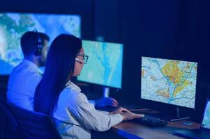 Diverse call center operators team use computers consulting clients in office photo