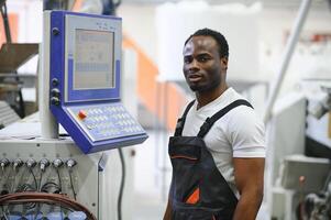 Portrait of industrial engineer. factory worker standing in factory production line photo