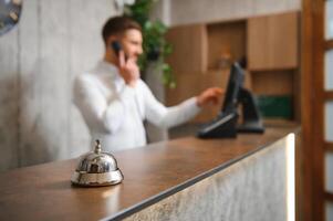 Portrait of receptionist at desk in lobby photo