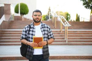 Happy indian male student at the university photo