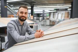 Man choosing flooring in hardware store photo