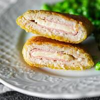 meat cutlet cordon bleu chicken, cheese, bacon meal snack on the table copy space food background photo