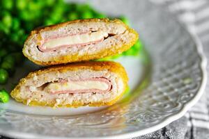 meat cutlet cordon bleu chicken, cheese, bacon meal snack on the table copy space food background photo
