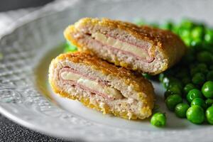 meat cutlet cordon bleu chicken, cheese, bacon meal snack on the table copy space food background photo