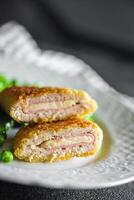 meat cutlet cordon bleu chicken, cheese, bacon meal snack on the table copy space food background photo