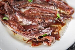 anchovies in a plate on the table canned fish in oil fresh and tasty seafood meal food snack on the table copy space food background rustic photo