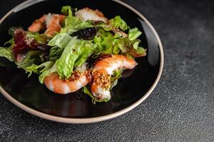 shrimp salad prawns or langoustines green leaf lettuce mix fresh meal food snack on the table copy space food background rustic top view photo