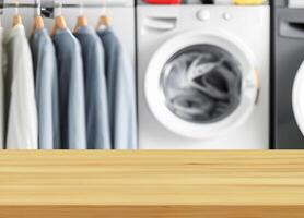 Wood table for display products on background of blurred laundry room photo
