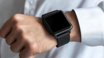 Close up of businessman wearing black smartwatch photo