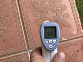 Measuring temperature with a non-contact thermometer photo