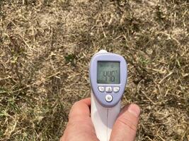 Measuring temperature with a non-contact thermometer photo