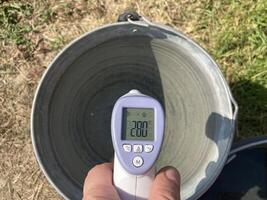 Measuring temperature with a non-contact thermometer photo
