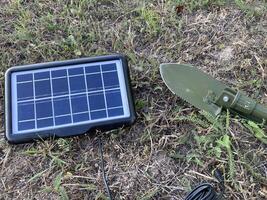 Solar battery for charging your smartphone while hiking photo