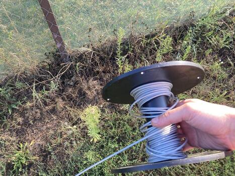 Strengthening a fence with a shading net with a rope photo