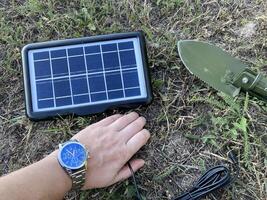 Solar battery for charging your smartphone while hiking photo