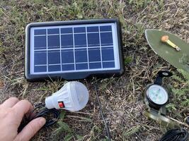 Solar battery for charging your smartphone while hiking photo