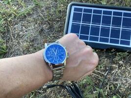 Solar battery for charging your smartphone while hiking photo