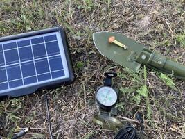 Solar battery for charging your smartphone while hiking photo
