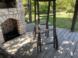 A stepladder stands on the veranda photo