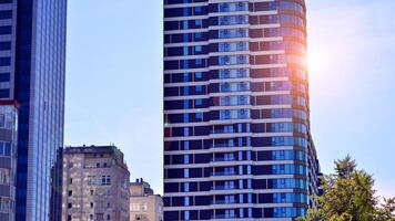 Exterior of a high modern multi-story apartment building - facade, windows and balconies. photo