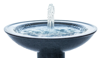 Water fountain with a steady stream in a decorative basin during a bright daylight setting, cut out - stock . png