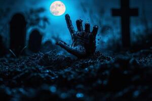 Zombie hand breaking through the earth in the cemetery at night. photo