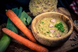 Peas Pisum sativum on olive wood for a pea soup photo