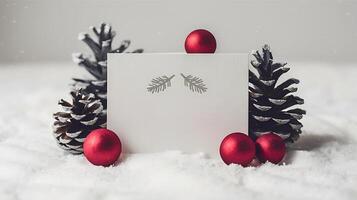 christmas blank greeting card mockup with small red and gray pine cones snowy simple background photo