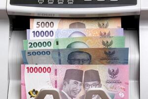 Indonesian rupiah in the counting machine photo