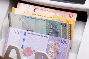 Malaysian ringgit in the counting machine photo