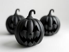 Three black jack-o-lanterns with carved faces on white background. Close up of Halloween pumpkins with sinister expressions, creating spooky, eerie atmosphere. Ai generation photo
