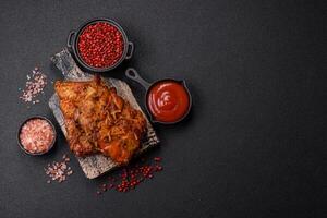 Delicious juicy grilled ribs with honey and mustard sauce with salt, spices and herbs photo