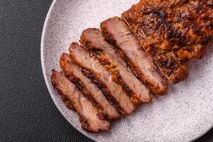 Fresh juicy delicious beef steak on a dark background photo